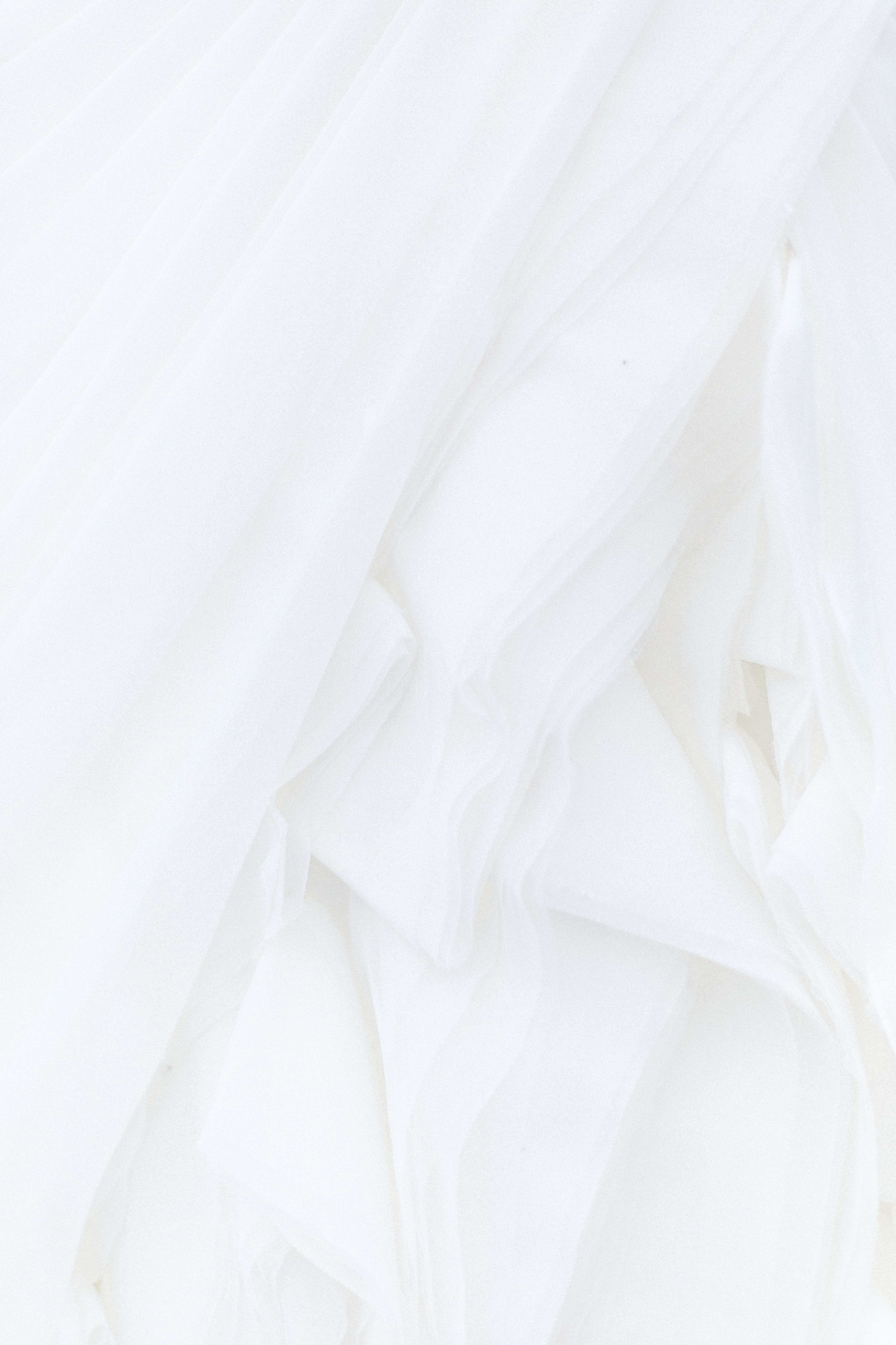 white textile in close up photography