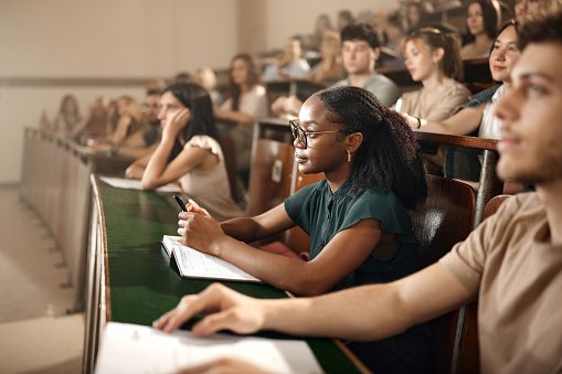person holding black academic hat