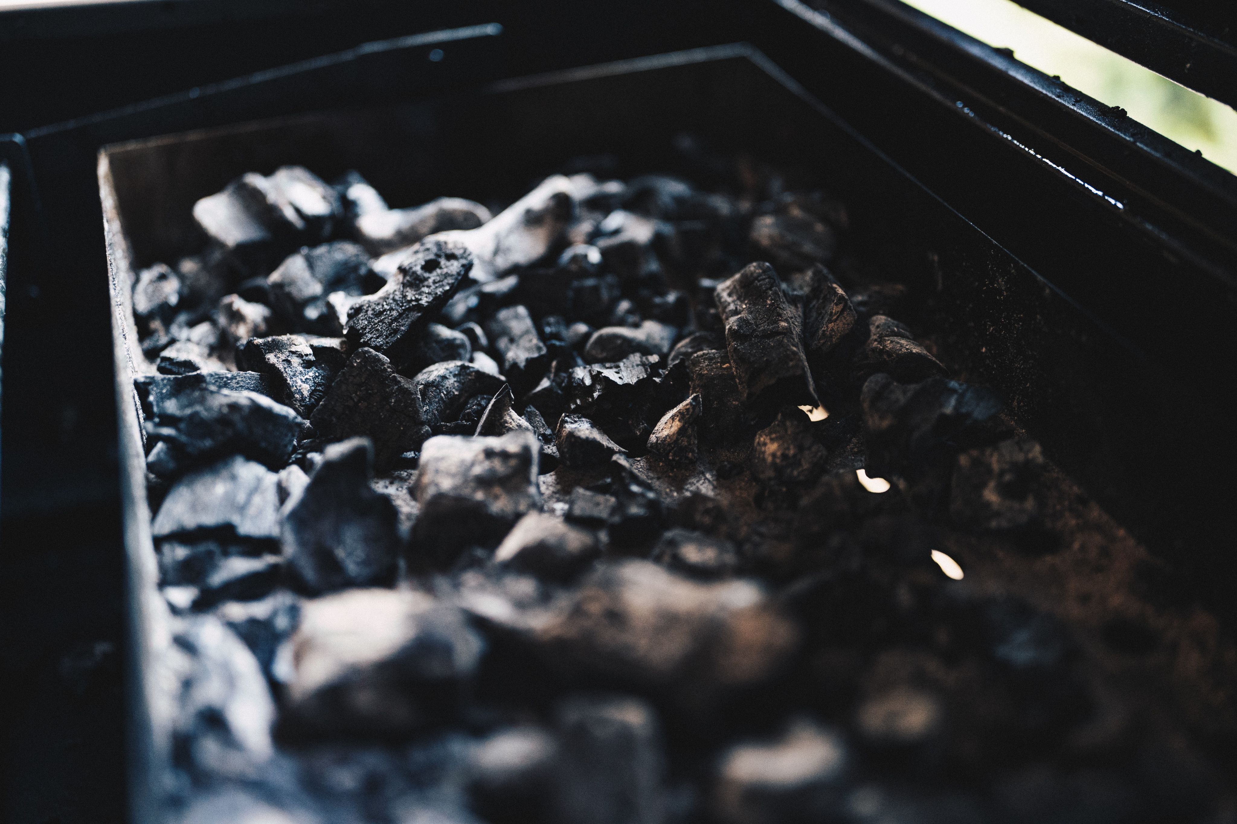 selective focus photography of black charcoal
